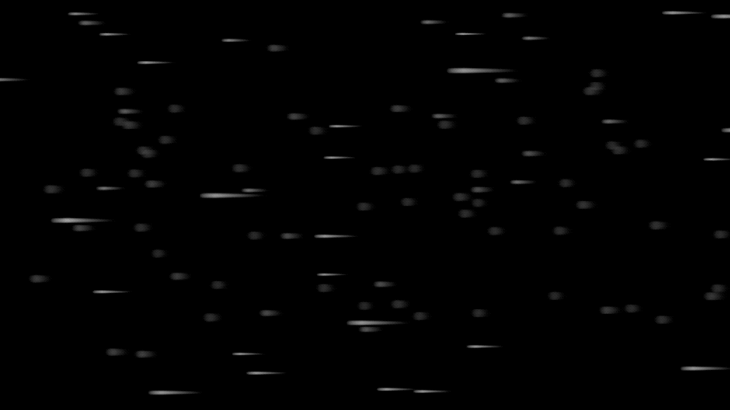 This animation shows a sideways rain of small gray streaks against a black background. The streaks represent neutrinos that fill space. 