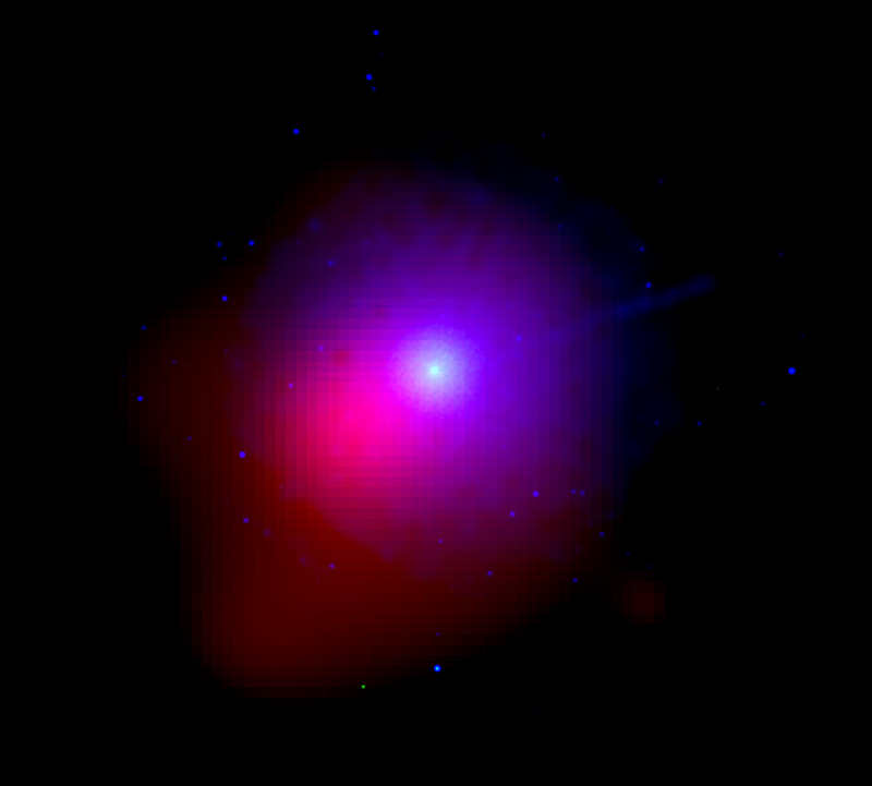 A bright ball of white light is surrounded by a halo of purple and pink. The purple appears in a circle around the white light while the pink is offset to the left and below the central white ball. This is all on a black background dotted with blue stars.